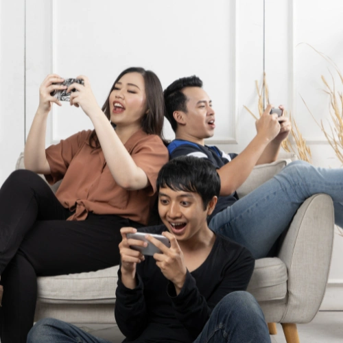 Family enjoying high-speed satellite internet on laptop, tablet, and smartphone from their living room couch.